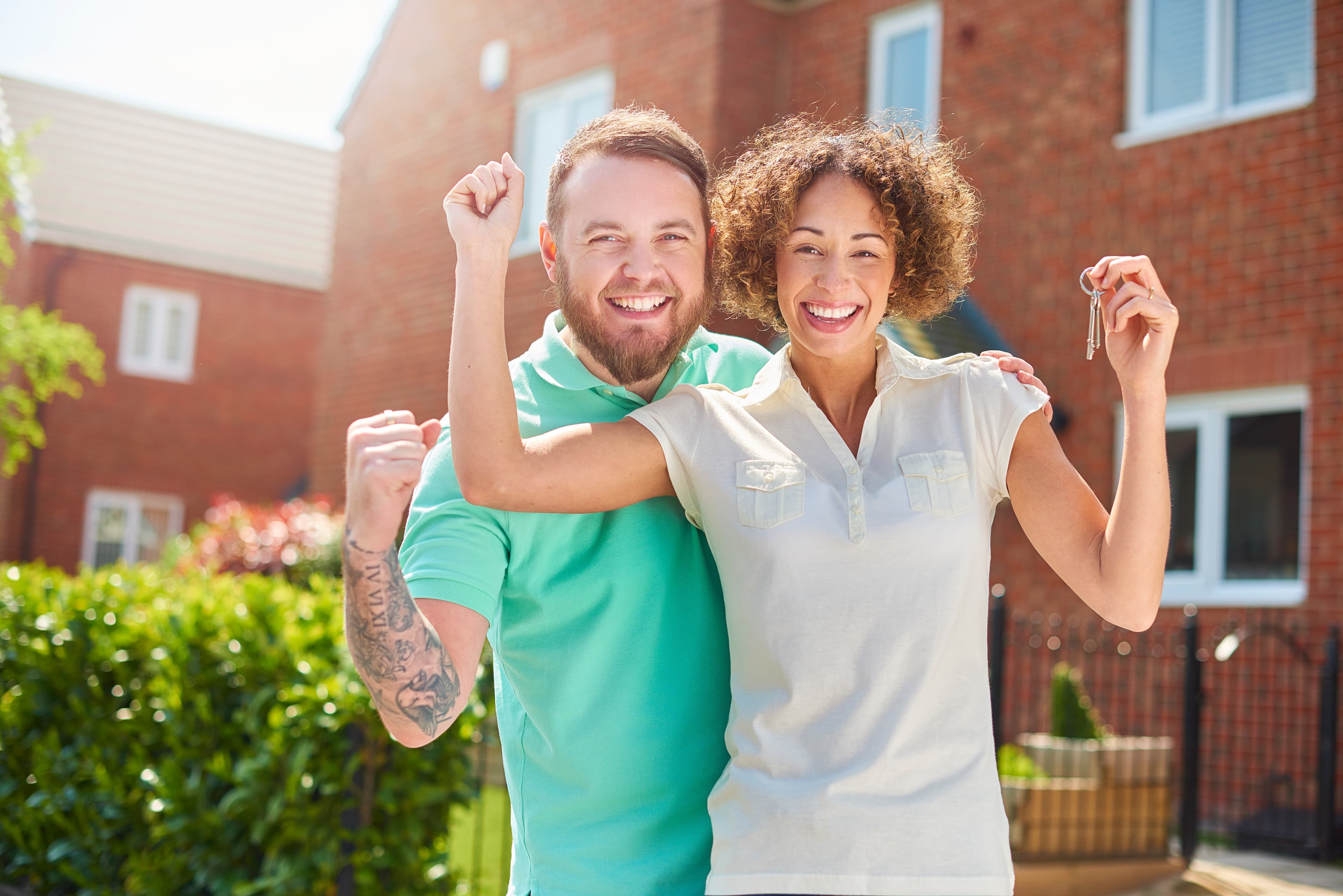 Happy family receiving keys to their new home